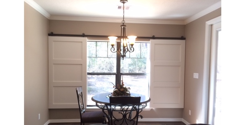 Barn doors open horizontally with slides instead of cords. Minneapolis barn door shutters